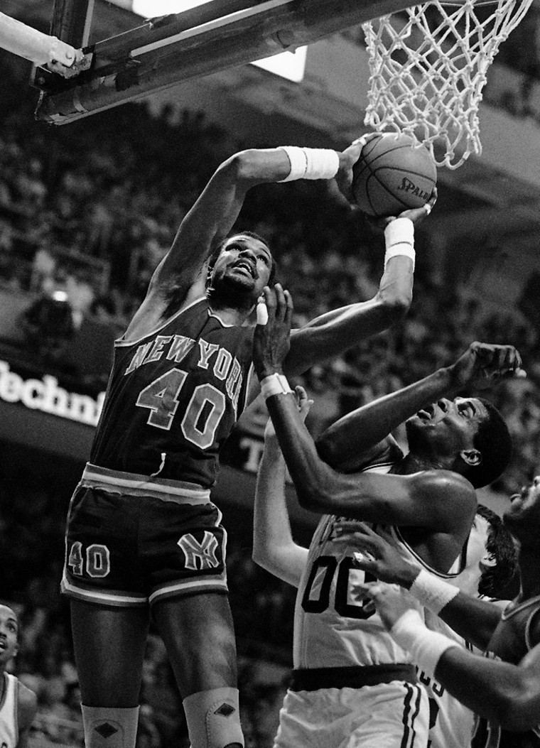 FILE - In this April 30, 1984 file photo, New York Knick Marvin Webster (40) goes to the hoop as Boston Celtics Robert Parish (00) tries to defend during second period NBA playoff action at the Boston Garden in Boston. Webster, a former NBA star, was found dead in a bathtub at a Tulsa hotel on Monday morning, April 8, 2009. Police spokesman Jason Willingham says foul play is not suspected and the death apparently stemmed from an illness. The medical examiner office says the cause of death has not been determined. (AP Photo/Mike Kullen, File)